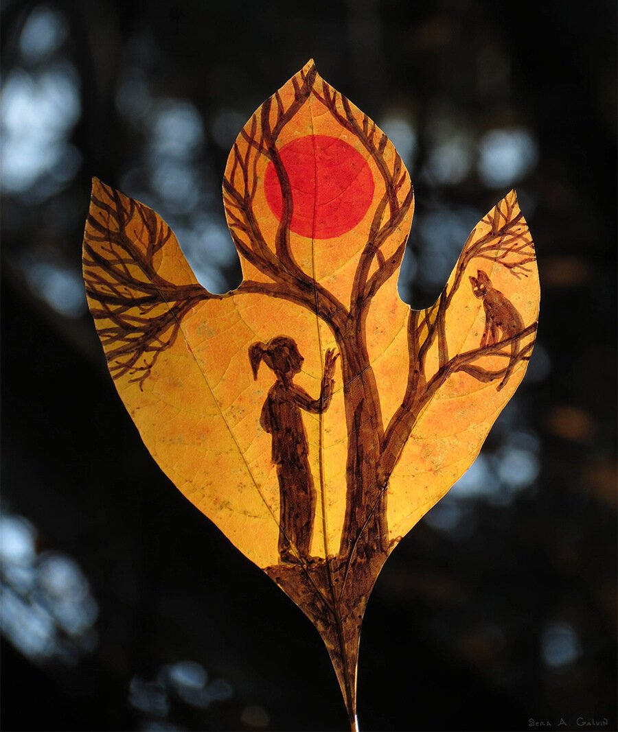 A silhouetted girl reaching toward a cat in a bare tree beneath a red sun, drawn on a golden three-lobed leaf against dark bokeh, by Sera Autumn