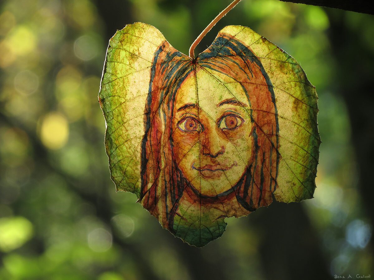 A young girl's face with long auburn hair and wide eyes drawn on a translucent green leaf, backlit against dappled forest bokeh, by Sera Autumn