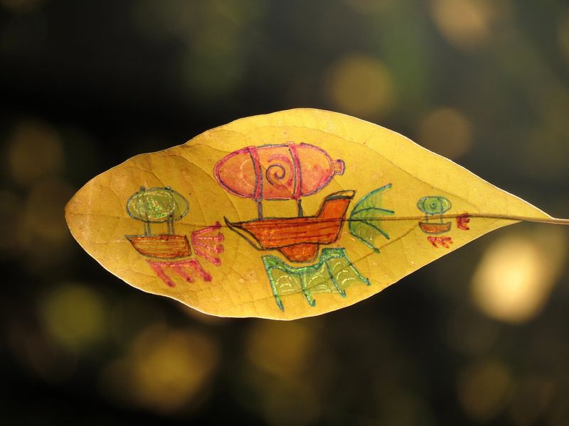 A whimsical fleet of airships and flying boats in orange, pink and green drawn on a golden leaf against dark bokeh, by Sera Autumn